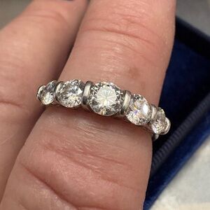 Moissanite band in silver. bar set